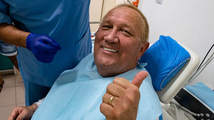 Dr George with patient for basal dental implants video testimonial